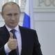 Russia's President Vladimir Putin gestures as he watches the launch of the newest heavy-class Angara-A5 rocket at Plesetsk cosmodrome in Arkhangelsk region, via a video link at the Russian Presidential Situation center at the Kremlin in Moscow, December 23, 2014.